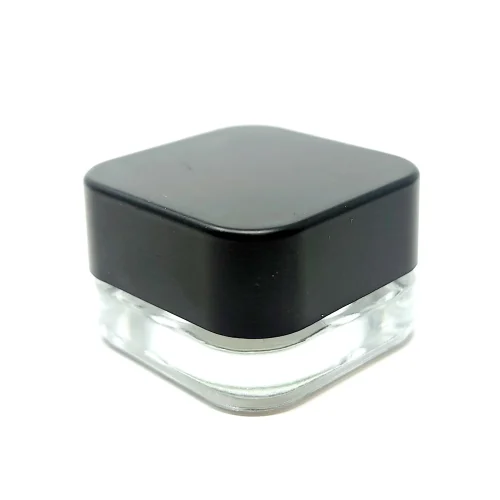 Small transparent glass jars with sleek black lid